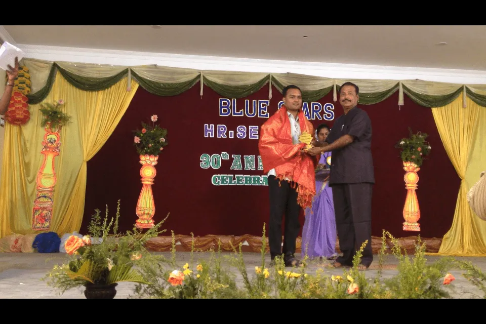 Recieving Honourable Award from blue start school